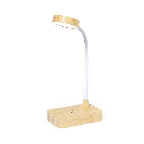 Lámpara cargador fabricada en resistente bambú. Con cargador inalámbrico 15W integrado y lámpara de 12 LEDs, mástil flexible y 3 posiciones de iluminación (cálida, fría y media), además de regulador de intensidad de la luz. Compatible con dispositivos móviles de carga inalámbrica, con cable cargador Tipo C y presentada en una atractiva caja de diseño kraft. Disponible manual de instrucciones en español e inglés.Materiales como el bambú fomentan la utilización de materias primas naturales, reduciendo las emisiones contaminantes. Proviene de una planta de gran resistencia y versatilidad, con crecimiento y regeneración rápidos, siendo una excelente alternativa al uso de madera tradicional.Fabricada conforme a los estándares RoHS y en cumplimiento con los siguientes requisitos de seguridad:Sistema de protección contra sobrecalentamiento.Sistema de protección contra sobrecarga.Sistema de bloqueo para evitar cortocircuitos.