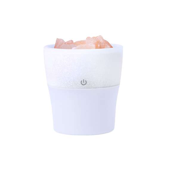 Elegante y decorativo humidificador con difusor aromático integrado con sal del Himalaya. Con luz led en iluminación multicolor y vaporización continua. Depósito de 150 ml, para uso en estancias de hasta 25m2, y cable de corriente USB. Incluye 10 ml de aroma a lavanda. Presentado en caja de diseño kraft.