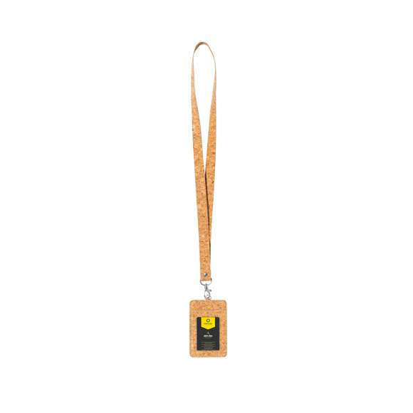 Identificador lanyard fabricado en corcho. Suave cordón hecho con corcho natural con cierre de mosquetón giratorio y un portatarjetas con ventanilla de PVC. Elaborado con elementos vegetales para así fomentar la utilización de materias primas naturales y reducir las emisiones contaminantes.
