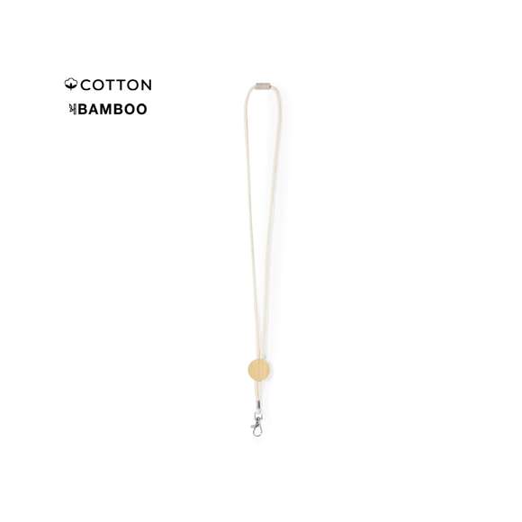 Lanyard fabricado en resistente algodón 100% y bambú. Accesorio circular especial para la personalización de bambú y cierre de seguridad en cuello fabricado en caña de trigo, con mosquetón metálico giratorio.Materiales como el bambú fomentan la utilización de materias primas naturales, reduciendo las emisiones contaminantes. Proviene de una planta de gran resistencia y versatilidad, con crecimiento y regeneración rápidos, siendo una excelente alternativa al uso de madera tradicional.