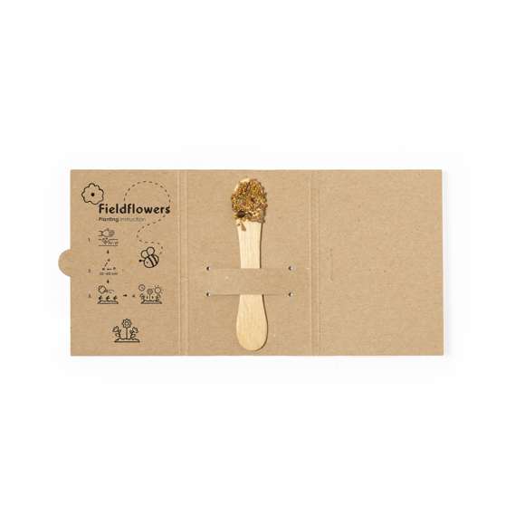 Stick con semillas. En uno de los extremos tiene una zona amplia para marcaje y en el otro extremo incluye semillas de flores silvestres listas para plantar. Presentado en una tarjeta de cartón reciclado con instrucciones de plantado.