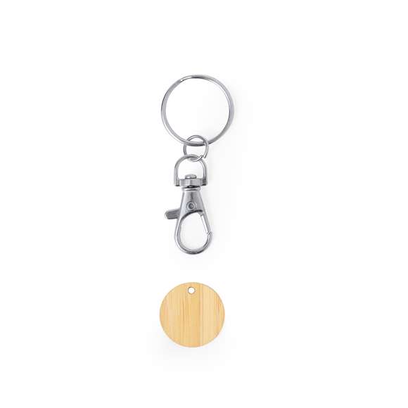 Llavero moneda fabricado en bambú. Con cierre de mosquetón giratorio y anilla para llaves. Incluye moneda fabricada en bambú con un grabado en forma del carro de la compra.Materiales como el bambú fomentan la utilización de materias primas naturales, reduciendo las emisiones contaminantes. Proviene de una planta de gran resistencia y versatilidad, con crecimiento y regeneración rápidos, siendo una excelente alternativa al uso de madera tradicional.