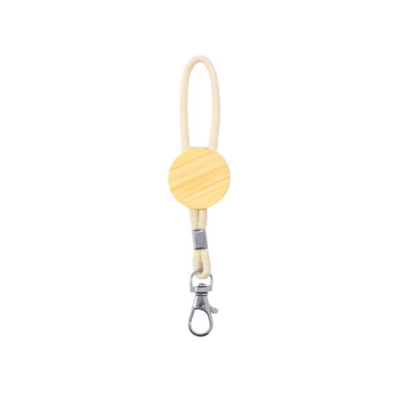 Llavero ecológico fabricado en bambú y con cordón en algodón. Incluye una pieza redonda especial para marcaje y un mosquetón giratorio metálico. Presentado individualmente en bolsa de papel reciclado.Materiales como el bambú fomentan la utilización de materias primas naturales, reduciendo las emisiones contaminantes. Proviene de una planta de gran resistencia y versatilidad, con crecimiento y regeneración rápidos, siendo una excelente alternativa al uso de madera tradicional.