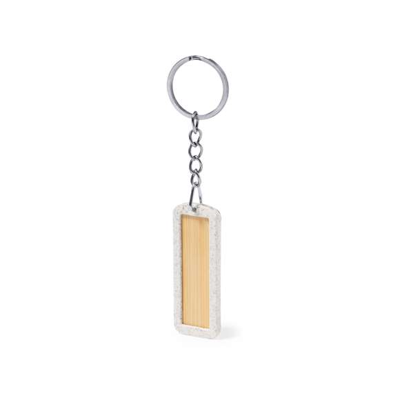 Llavero eco fabricado en bambú con marco en caña de trigo. De forma rectangular y con amplia zona de marcaje. La caña de trigo fomenta la utilización de materias primas naturales, reduciendo así las emisiones contaminantes.
