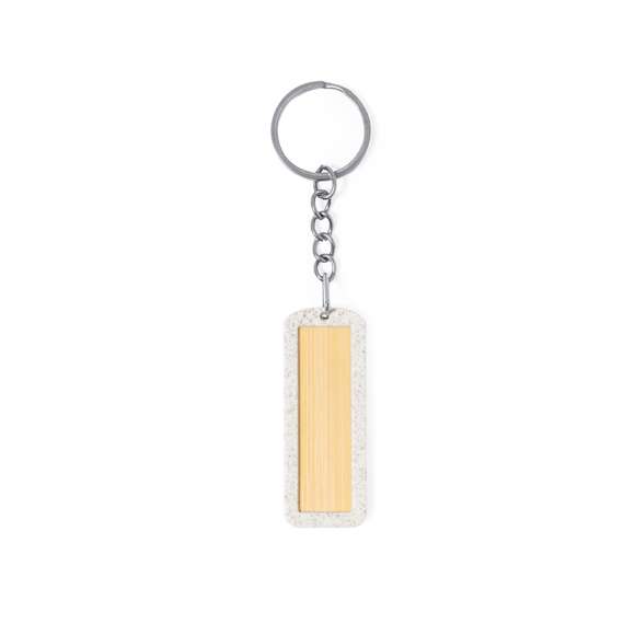 Llavero eco fabricado en bambú con marco en caña de trigo. De forma rectangular y con amplia zona de marcaje. La caña de trigo fomenta la utilización de materias primas naturales, reduciendo así las emisiones contaminantes.