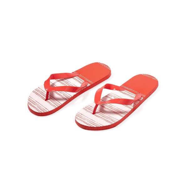 Par de chanclas fabricadas en EVA y PVC. Suela hecha de resistente EVA para una alta durabilidad, con atractivo diseño bicolor, y tiras ergonómicas fabricadas en PVC a juego. Disponibles en una variada gama de colores vibrantes con diseño en blanco adaptándose a cualquier estilo. Tallas 36-38 y 42-44. Cada par presentado en bolsa reciclada.