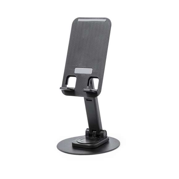 Soporte plegable para smartphone y tablet, fabricado en resistente aluminio y ABS. Regulable en altura, con almohadillas de goma antideslizantes en base y soporte. En sobrio acabado de color blanco o negro, y con amplia superficie de marcaje. Presentado en atractiva caja de diseño.