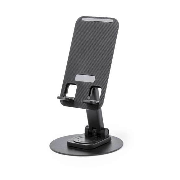 Soporte plegable para smartphone y tablet, fabricado en resistente aluminio y ABS. Regulable en altura, con almohadillas de goma antideslizantes en base y soporte. En sobrio acabado de color blanco o negro, y con amplia superficie de marcaje. Presentado en atractiva caja de diseño.