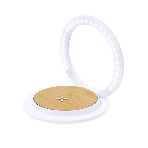 Lámpara multifunción fabricada en bambú. Con cargador inalámbrico de 15W integrado y 27 LEDs en un aro plegable que también hace de soporte. Compatible con dispositivos móviles de carga inalámbrica y con cable cargador Tipo C incluido, y presentada en una atractiva caja de diseño kraft. Disponible manual de instrucciones en español e inglés.Materiales como el bambú fomentan la utilización de materias primas naturales, reduciendo las emisiones contaminantes. Proviene de una planta de gran resistencia y versatilidad, con crecimiento y regeneración rápidos, siendo una excelente alternativa al uso de madera tradicional.Fabricada conforme a los estándares RoHS y en cumplimiento con los siguientes requisitos de seguridad:Sistema de protección contra sobrecalentamiento.Sistema de protección contra sobrecarga.Sistema de bloqueo para evitar cortocircuitos.