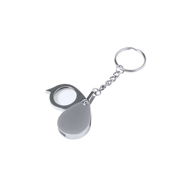 Práctico llavero lupa plegable, con aumento de 8x y fabricado en resistente metal. Fácil de transportar por su reducido tamaño y presentado en caja de cartón negra.