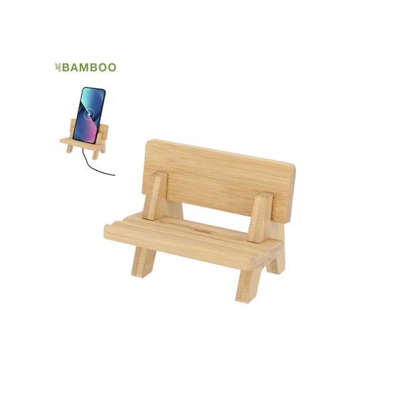 Soporte para dispositivo móvil en original forma de banco, fabricado en resistente Bambú. Con piezas desmontables que permiten 3 posiciones diferentes del dispositivo. Incluye ranura para el cable de carga, permitiendo cargar el dispositivos miestras está en el soporte.Materiales como el Bambú fomentan la utilización de materias primas naturales reduciendo las emisiones contaminantes. Además, el Bambú proviene de una planta de gran resistencia y versatilidad, con crecimiento y regeneración rápida, siendo una excelente alternativa al uso de madera tradicional.