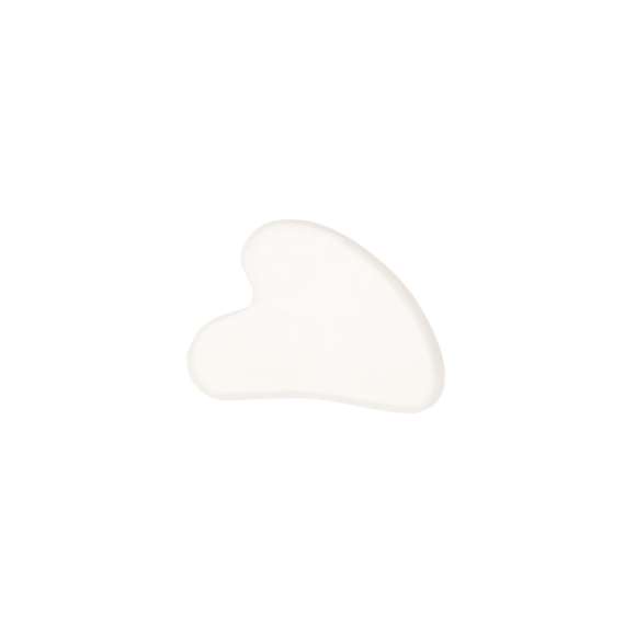Masajeador facial elaborado en piedra jade blanca. Es ideal para complementar rutinas de cuidado facial. Presentada en bolsa de algodón natural.