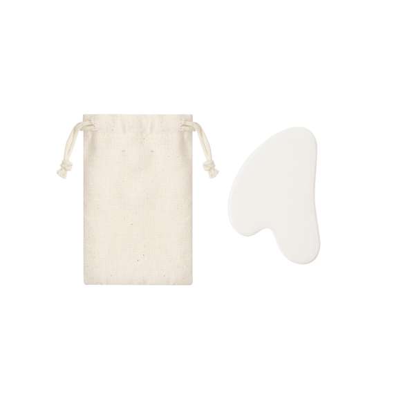 Masajeador facial elaborado en piedra jade blanca. Es ideal para complementar rutinas de cuidado facial. Presentada en bolsa de algodón natural.