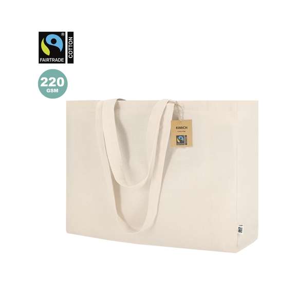 Bolsa confeccionada principalmente en algodón de 220g/m2. Con certificación Fairtrade (Comercio Justo) un sistema comercial solidario y alternativo al convencional que persigue el desarrollo de los pueblos y la lucha contra la pobreza. De acabado cosido con fuelle, asas largas reforzadas de 70cm y resistencia hasta 10kg de peso. Incluida etiqueta Fairtrade y hangtag distintivo en cartón reciclado.