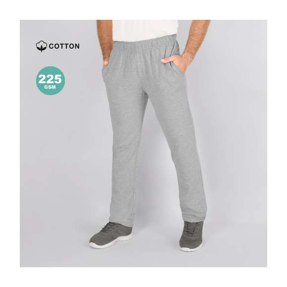 Pantalón largo unisex en algodón de punto liso y corte recto. Con dos bolsillos laterales y cinturilla elástica con cordón ajustable a tono. Doble pespunte en los bajos.