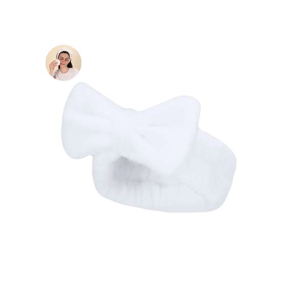 Diadema en forma de cinta para el cabello, adornada con un elegante lazo. Confeccionada en suave y elástico poliéster, ideal para facilitar la rutina de lavado facial.
