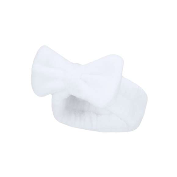 Diadema en forma de cinta para el cabello, adornada con un elegante lazo. Confeccionada en suave y elástico poliéster, ideal para facilitar la rutina de lavado facial.
