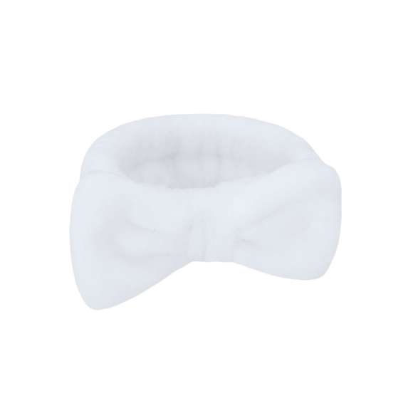 Diadema en forma de cinta para el cabello, adornada con un elegante lazo. Confeccionada en suave y elástico poliéster, ideal para facilitar la rutina de lavado facial.