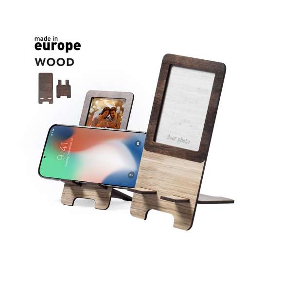  	Soporte para smartphone con portafotos integrado. Fabricado en madera natural, con original acabado bicolor. Amplia superficie de marcaje, de fácil montaje y con distintivo Made In Europe.