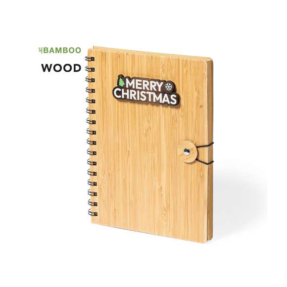 Libreta de anillas de línea nature y diseño navideño. Con tapas rígidas de bambú y original cierre elástico. Incluye 80 hojas con disposición a una raya y diseño eco.