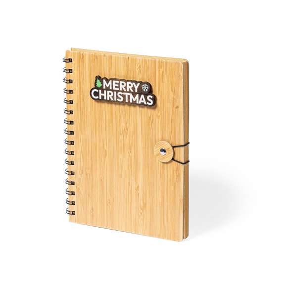 Libreta de anillas de línea nature y diseño navideño. Con tapas rígidas de bambú y original cierre elástico. Incluye 80 hojas con disposición a una raya y diseño eco.