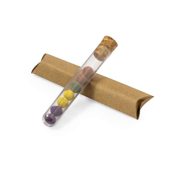 Set de bombón con semillas presentado en recipiente de plástico con tapón de corcho. Este kit de huerto contiene semillas de albahaca, hinojo, perejil y orégano. Presentado y protegido dentro de un sobre de cartón reciclado con instrucciones de plantado.