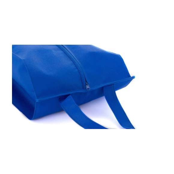 Zapatillero de non-woven en amplia gama de vivos colores. Con cremallera y cómoda asa de transporte a juego.