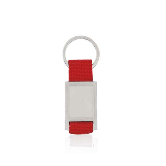  	Llavero de divertido diseño con cinta de poliéster de variados y vivos colores. Con cuerpo metálico troquelado especialmente diseñado para marcaje en doming/gota de resina.