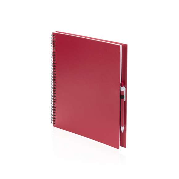 Libreta de anillas con tapas de suave tacto acabadas en resistente cartón reciclado y bolígrafo en cartón reciclado a juego. De atrevidos colores, 80 hojas lisas y con soporte para bolígrafo en contraportada.