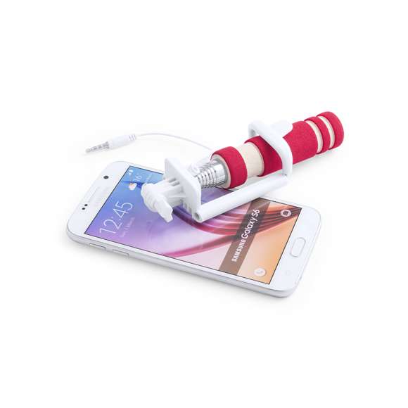  	Compacto palo selfie plegable, de diseño minimalista, con conexión jack de 3,5mm, sistema antigiro y disparador integrado en mango. Recorrido de acero inox y sistema de almohadillas en el soporte para así ofrecer un óptimo ajuste y protección del smartphone, además de una tuerca de ajuste a fijar según la inclinación que se desee, para así hacerse selfies todavía más variados y divertidos. Compatible con todo tipo de smartphones y especialmente diseñado para marcaje en mango a láser, con accesorios a juego y presentado en atractiva caja de diseño.