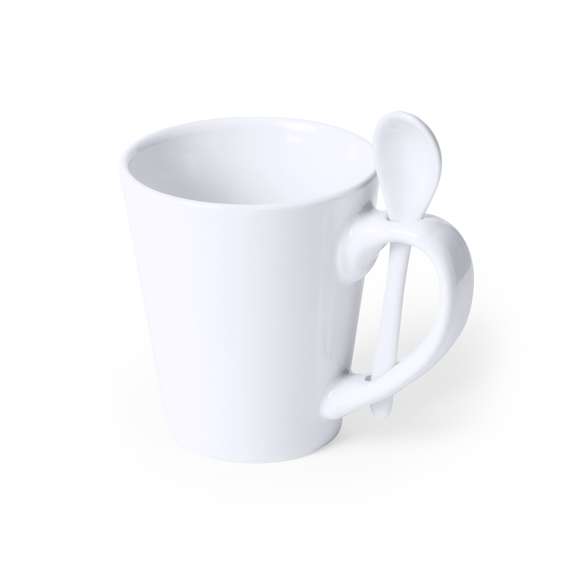 Taza de cerámica de 350ml de capacidad en color blanco y con cucharilla de cerámica integrada en el asa. Especialmente diseñada para marcaje en sublimación. Presentada en caja individual.Disponible manual de instrucciones en español e inglés.