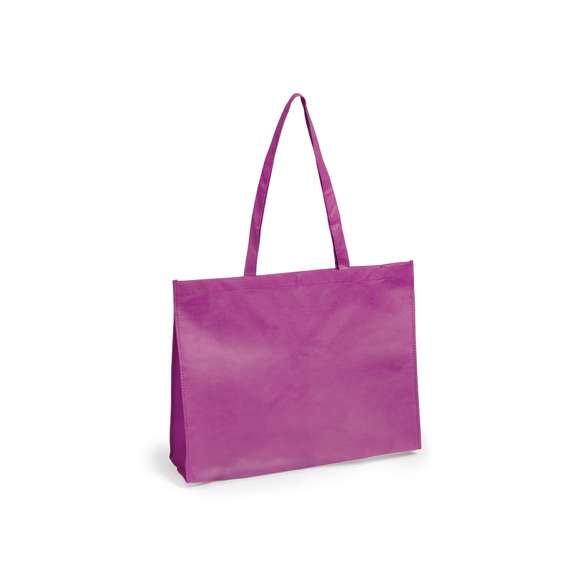 Bolsa en non-woven de 80g/m2, en variada gama de vivos colores. Con asas largas de 75cm, fuelle reforzado con ribete a juego y acabado cosido. Resistencia hasta 4kg de peso.