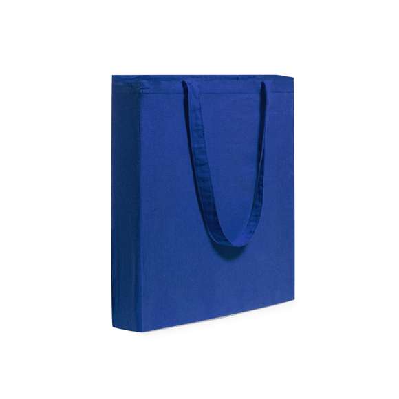 Bolsa en material 100% algodón en variada gama de vivos colores. Con asas largas de 70cm, fuelle y acabado cosido. Resistencia hasta 7kg de peso.