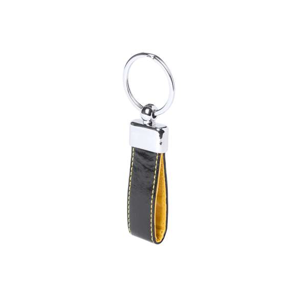 Llavero de elegante acabado en polipiel bicolor con accesorio metálico. Presentado en estuche individual troquelado.