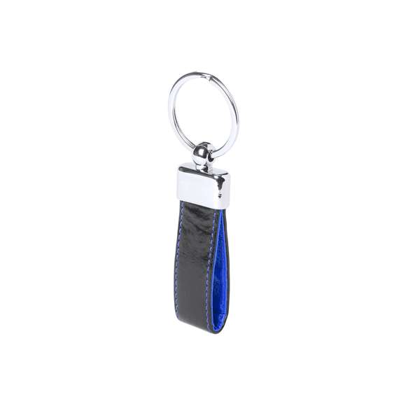 Llavero de elegante acabado en polipiel bicolor con accesorio metálico. Presentado en estuche individual troquelado.
