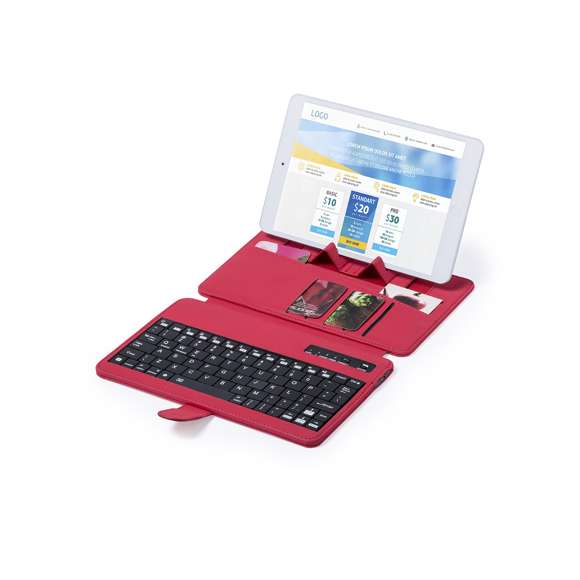 Teclado soporte Bluetooth® con función soporte para dispositivo móvil en suave acabado de polipiel. De diseño compacto, con solapa de cierre magnético, tarjeteros interiores, en atrevidos colores y recargable mediante cable mini USB -incluido-. Compatible con cualquier sistema operativo y presentado en atractiva caja de diseño.