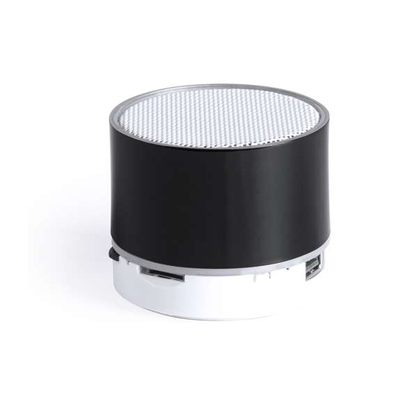 Compacto altavoz de conexión Bluetooth® con interior iluminado. Superficie exterior especialmente diseñada para marcaje en láser y así iluminar el logotipo marcado. De diseño bicolor con suave acabado y conexión Bluetooth® 3.0, ofrece 3W de potencia, tiene función de manos libres, una ranura para tarjetas micro SD de hasta 32 GB de capacidad, función radio FM, entrada auxiliar de línea mediante conexión jack de 3,5mm y soportes de goma antideslizantes en la base. Compatible con iOS y Android, incluye cable de carga mini USB, cable auxiliar jack de 3,5mm y viene presentado en atractiva caja de diseño. Con base antideslizante.