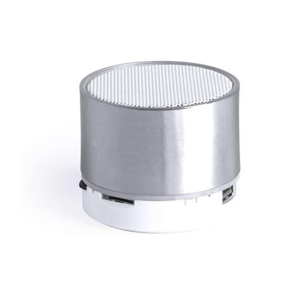 Compacto altavoz de conexión Bluetooth® con interior iluminado. Superficie exterior especialmente diseñada para marcaje en láser y así iluminar el logotipo marcado. De diseño bicolor con suave acabado y conexión Bluetooth® 3.0, ofrece 3W de potencia, tiene función de manos libres, una ranura para tarjetas micro SD de hasta 32 GB de capacidad, función radio FM, entrada auxiliar de línea mediante conexión jack de 3,5mm y soportes de goma antideslizantes en la base. Compatible con iOS y Android, incluye cable de carga mini USB, cable auxiliar jack de 3,5mm y viene presentado en atractiva caja de diseño. Con base antideslizante.