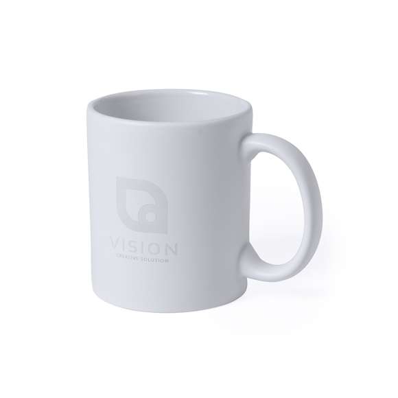 Taza de cerámica de alta calidad de 350ml de capacidad. Parte exterior en color blanco, especialmente diseñada para marcaje en láser, e interior en vivos colores. Al grabar el logotipo en la parte exterior, se muestra el color del interior de la taza. Presentada en caja individual.Disponible manual de instrucciones en español e inglés.