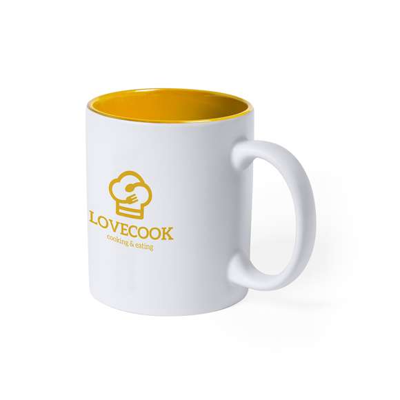 Taza de cerámica de alta calidad de 350ml de capacidad. Parte exterior en color blanco, especialmente diseñada para marcaje en láser, e interior en vivos colores. Al grabar el logotipo en la parte exterior, se muestra el color del interior de la taza. Presentada en caja individual.Disponible manual de instrucciones en español e inglés.