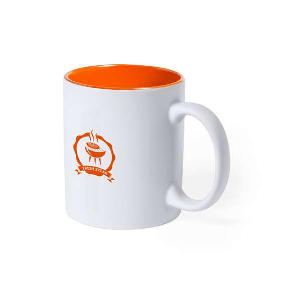 Taza de cerámica de alta calidad de 350ml de capacidad. Parte exterior en color blanco, especialmente diseñada para marcaje en láser, e interior en vivos colores. Al grabar el logotipo en la parte exterior, se muestra el color del interior de la taza. Presentada en caja individual.Disponible manual de instrucciones en español e inglés.