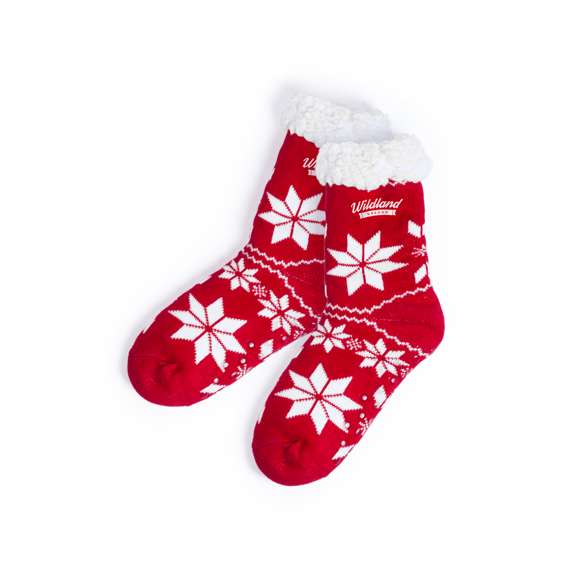 Par de calcetines anti deslizantes con motivos navideños, diseñados para andar por casa. De suave poliéster acrílico exterior y con cálido forro interior.