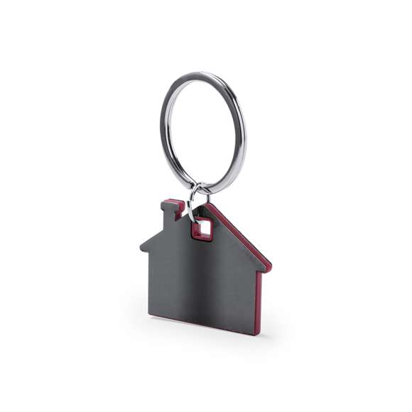 Llavero casita en original diseño con exterior en acero inox de tono gris espacial natural e interior en variada gama de colores. Presentado en bolsita individual con cartulina en elegante color gris.