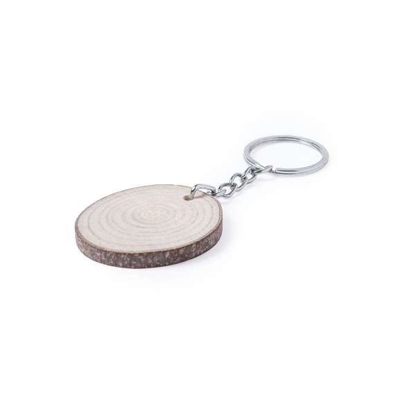  	Elegante llavero de línea nature. Piezas obtenidas al corte de madera de haya, por lo que su textura, color y grosor pueden variar, convirtiéndolo así en una pieza única.Con amplia superficie de marcaje y disponible en diseños ovalado y redondeado.
