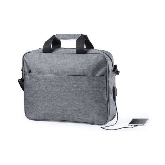 Portadocumentos de seguridad, con diseño urbano en resistente poliéster 300D. Bolsillo interior con protección de seguridad RFID (Identificación por Radio Frecuencia) que mantiene seguros los datos de la tarjeta y demás dispositivos. Asas con protección y compartimento principal con cierre de cremallera. Conexión USB -powerbank no incluido-, con bolsillos interiores acolchados para ordenador portátil de hasta 15 pulgadas y tablets de hasta 10 pulgadas. Cinta para hombro ajustable con protector acolchado.