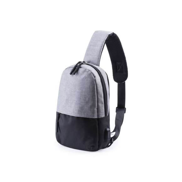  	Bandolera multiusos en resistente poliéster 300D. De atractivo diseño urbano, en combinación de colores gris denim y negro. Con conexión USB para carga -powerbank y cable no incluídos- y bolsillo acolchado para tablet de hasta 10 pulgadas. Espalda y cinta acolchadas, con cinta de ajuste regulable. Bolsillo principal de fácil apertura, con cierre de cremallera y resistentes tiradores.