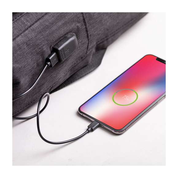 Mochila antirrobo en resistente material poliéster 300D. Con bolsillo antirrobo en la espalda para guardar objetos de valor. Compartimento interior con salida USB para conexión de powerbank -no incluido-. Incluye cable micro USB para total comodidad en la carga de cualquier dispositivo móvil. Bolsillo en lateral con protección RFID y compartimentos interiores acolchados para tablets de hasta 10 pulgadas y portátiles de hasta 15 pulgadas. Cinta para fijación al trolley y disponible en amplia gama de colores, con multitud de bolsillos interiores y exteriores. Cintas de hombros y espalda ajustables con acolchado.