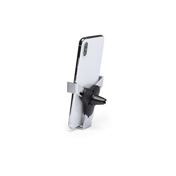 Ingenioso soporte para smartphone de diseño minimalista y especialmente diseñado para smartphones tamaño XXL. Con sistema de fijación universal que se activa por el propio peso del teléfono, ajustando las pinzas de agarre una vez que se sitúa el dispositivo en el soporte. Para rejilla de ventilación del automóvil y con frontal especialmente diseñado para marcaje en tampografía.