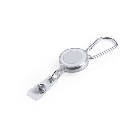 Porta objetos extensible de sobrio diseño, con cinta de fijación de cierre de botón y mecanismo extensible de hasta 65 cm. Incluye mosquetón metálico de enganche. Especialmente diseñado para fijar objetos de uso cotidiano y obtener fácil acceso a los mismos (llaveros anticontacto, punteros de seguridad...). Amplia superficie de marcaje en la pieza central.