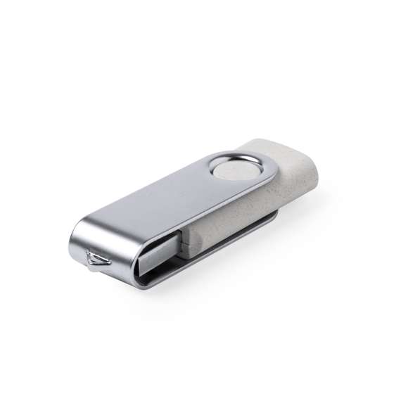 Memoria USB de 16GB de capacidad en línea nature. Cuerpo en caña de trigo, para así fomentar la utilización de materias primas naturales y reducir las emisiones contaminantes y clip metálico de mecanismo giratorio. Presentada en estuche individual de diseño eco.